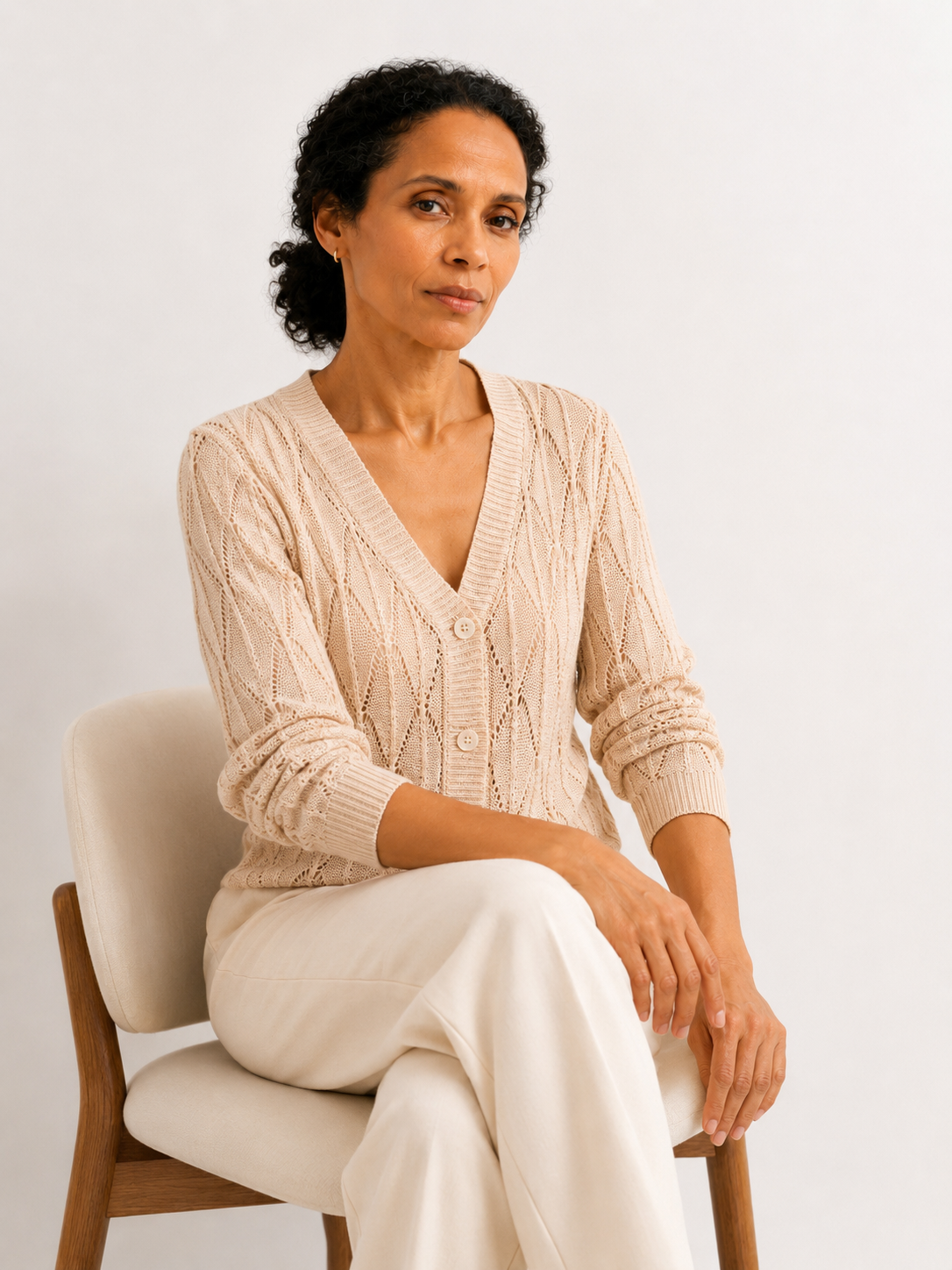 MY021 apricot openwork v-neck three-quarter sleeve cardigan seated model view