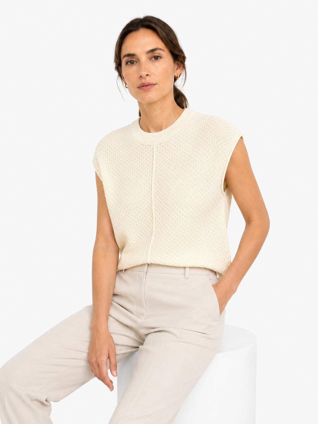 MY017 white textured sleeveless sweater tank seated model view