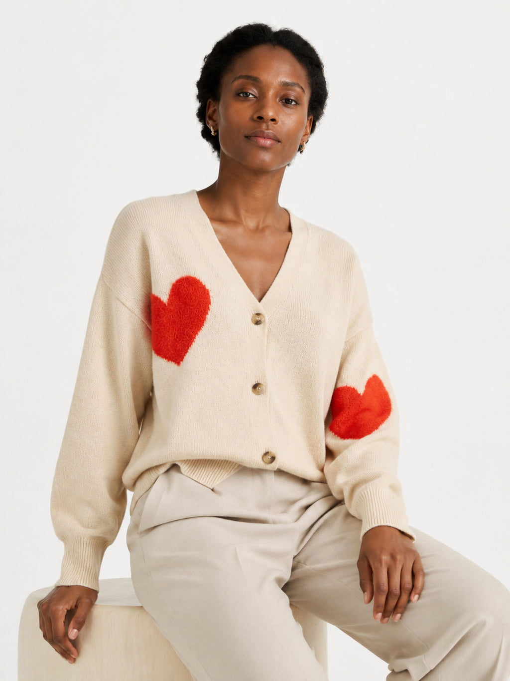 MY014 apricot oversized jacquard knit cardigan seated model view
