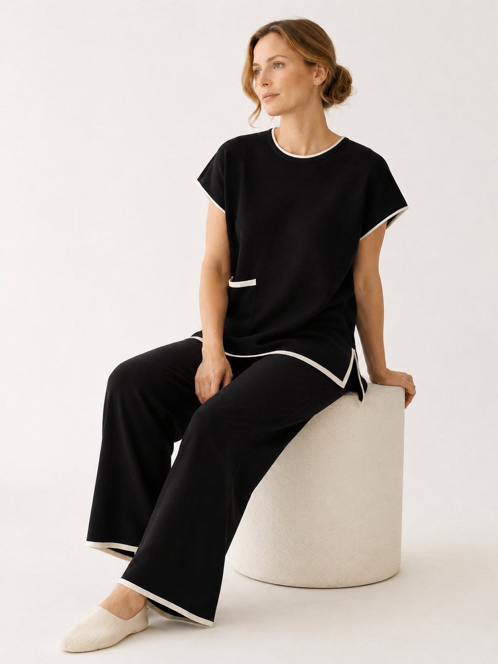 MY001 black contrast-trim sleeveless knit set seated model view