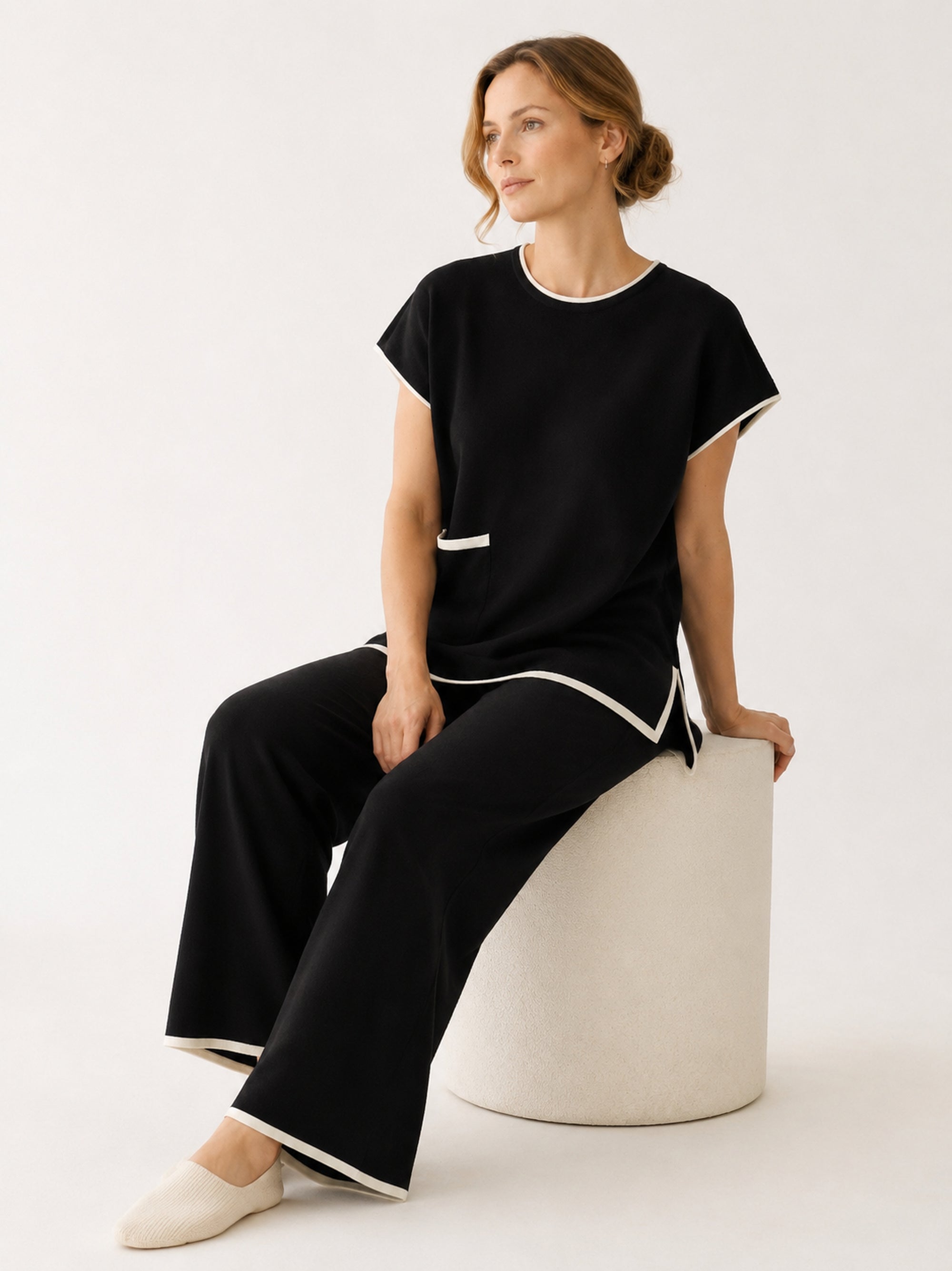 MY001 black contrast-trim sleeveless knit set seated model view