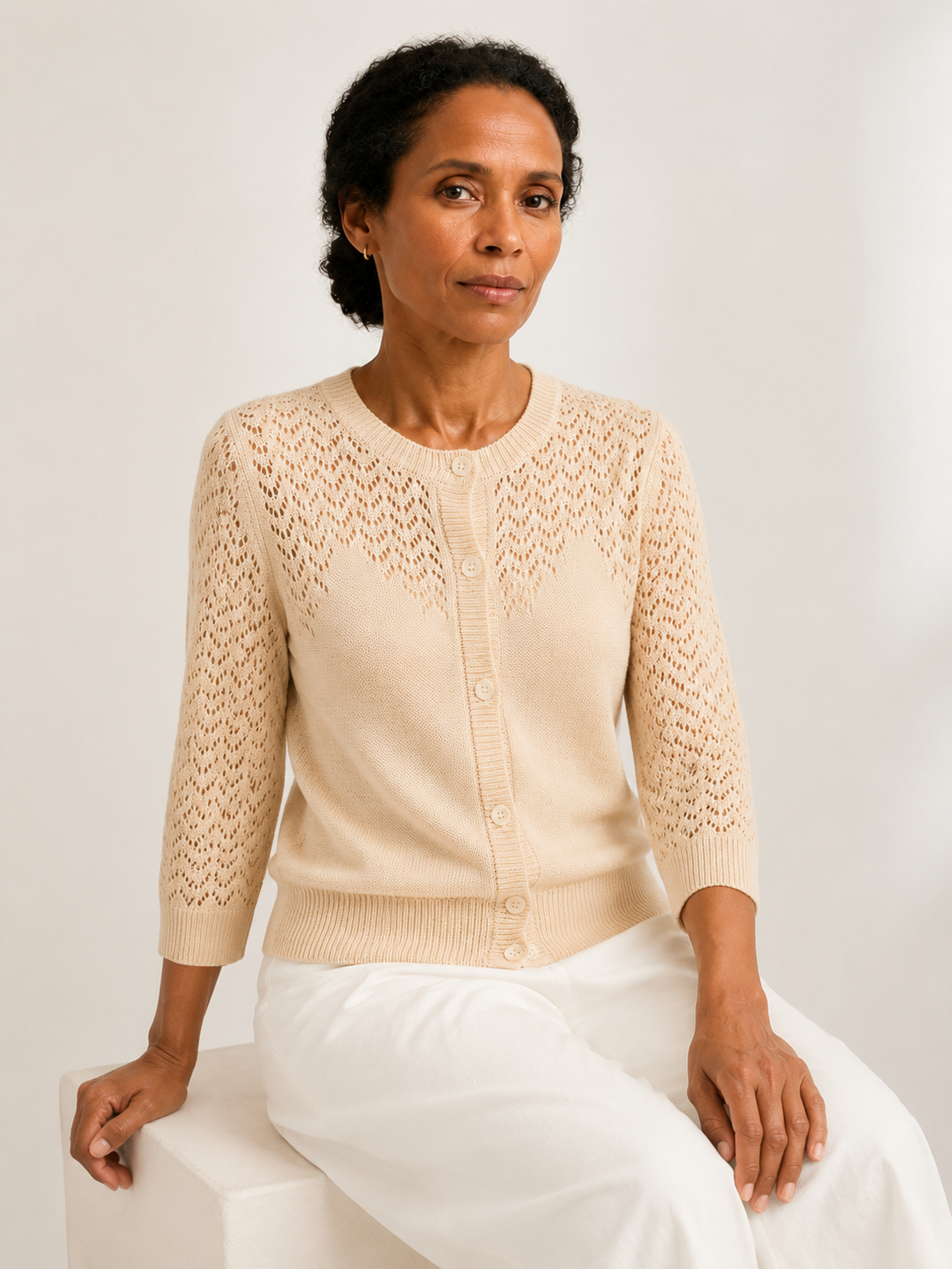 MY023 apricot openwork round-neck three-quarter sleeve cardigan seated model view