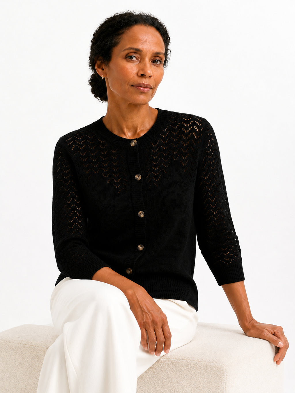 MY023 black openwork round-neck three-quarter sleeve cardigan seated model view