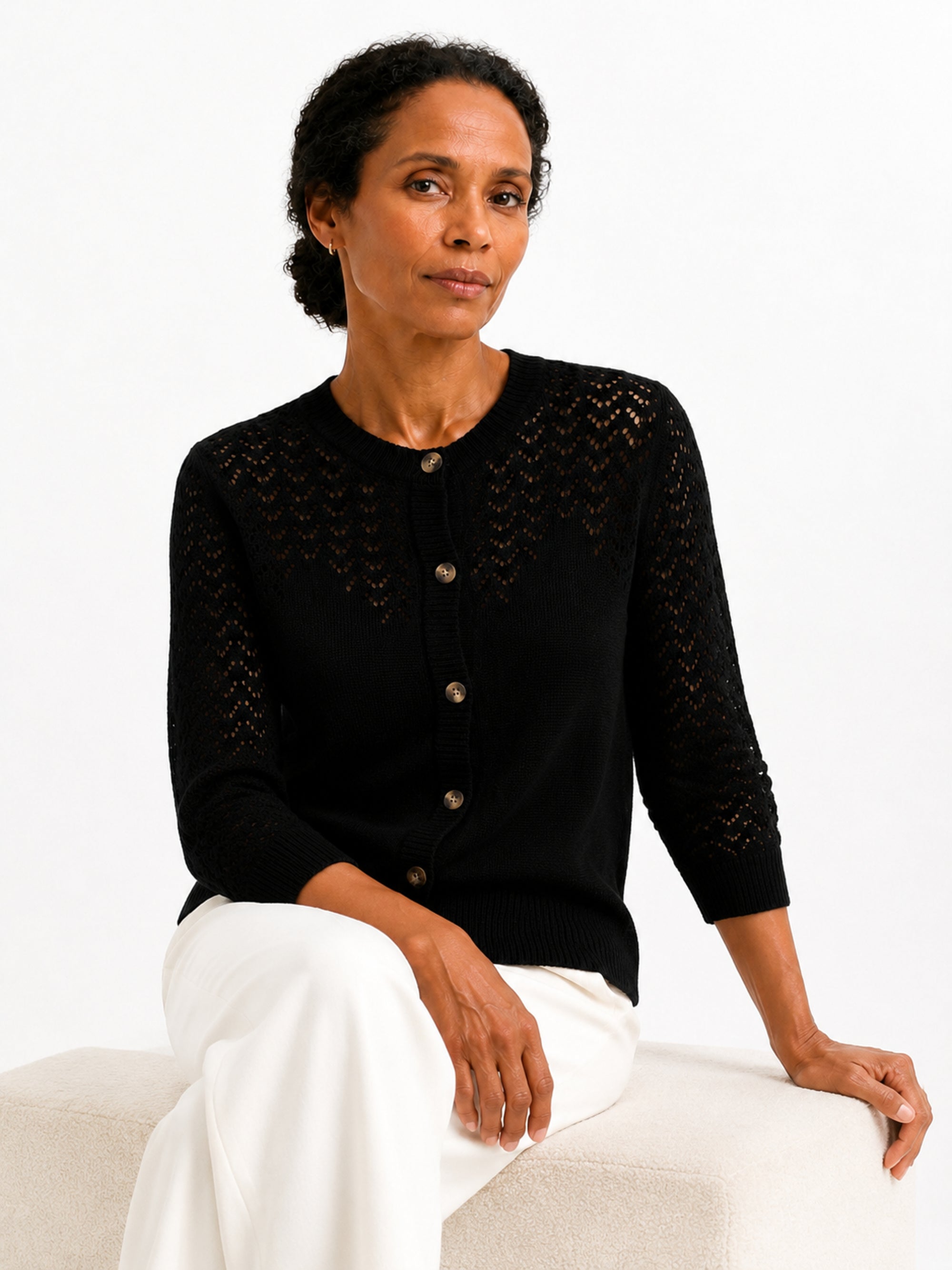 MY023 black openwork round-neck three-quarter sleeve cardigan seated model view