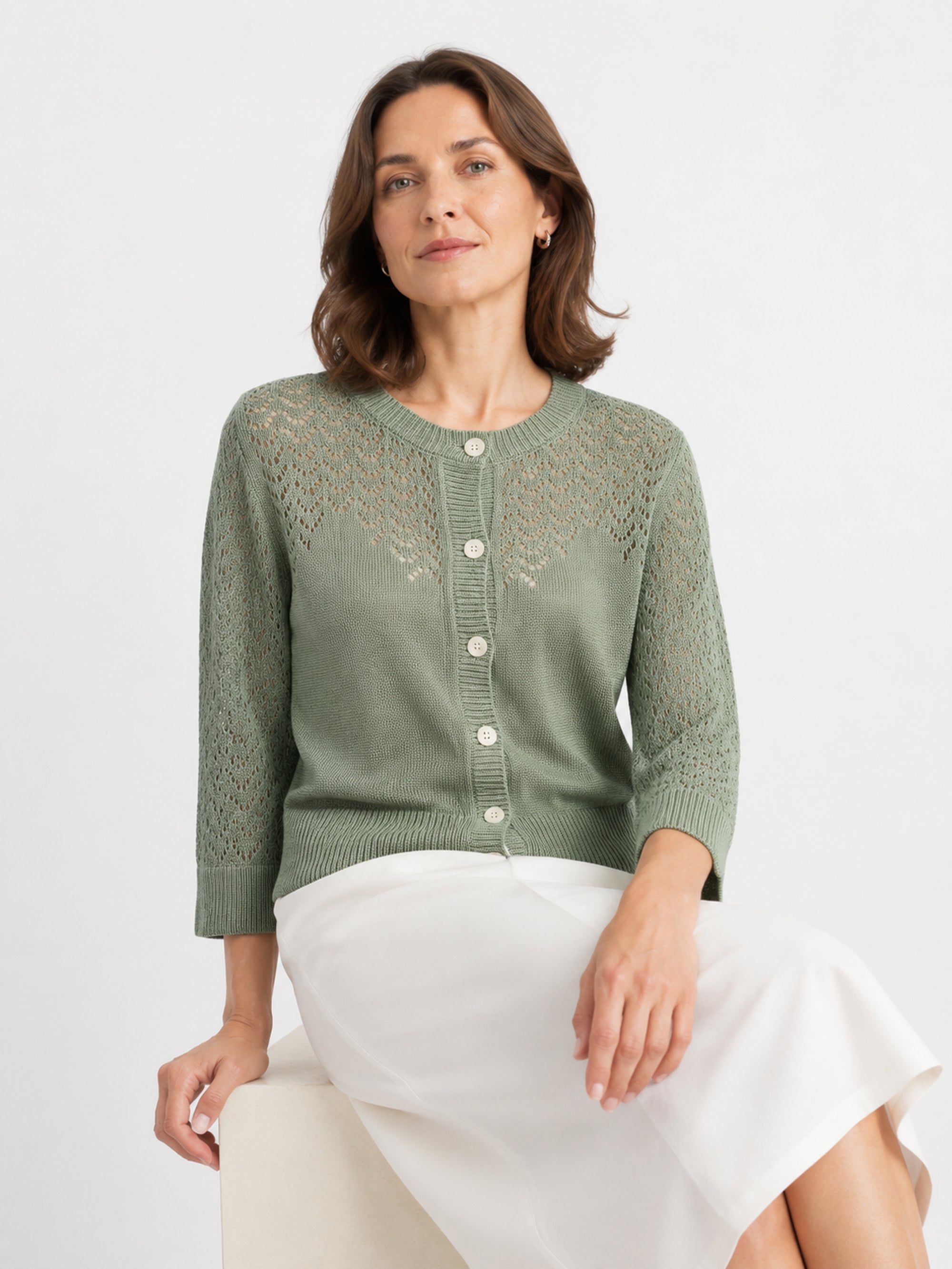 MY023 green openwork round-neck three-quarter sleeve cardigan seated model view