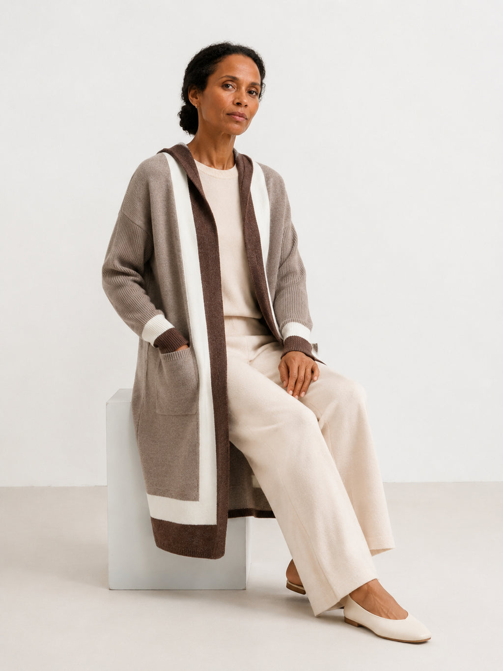 MY004 brown hooded long knit cape cardigan seated model view