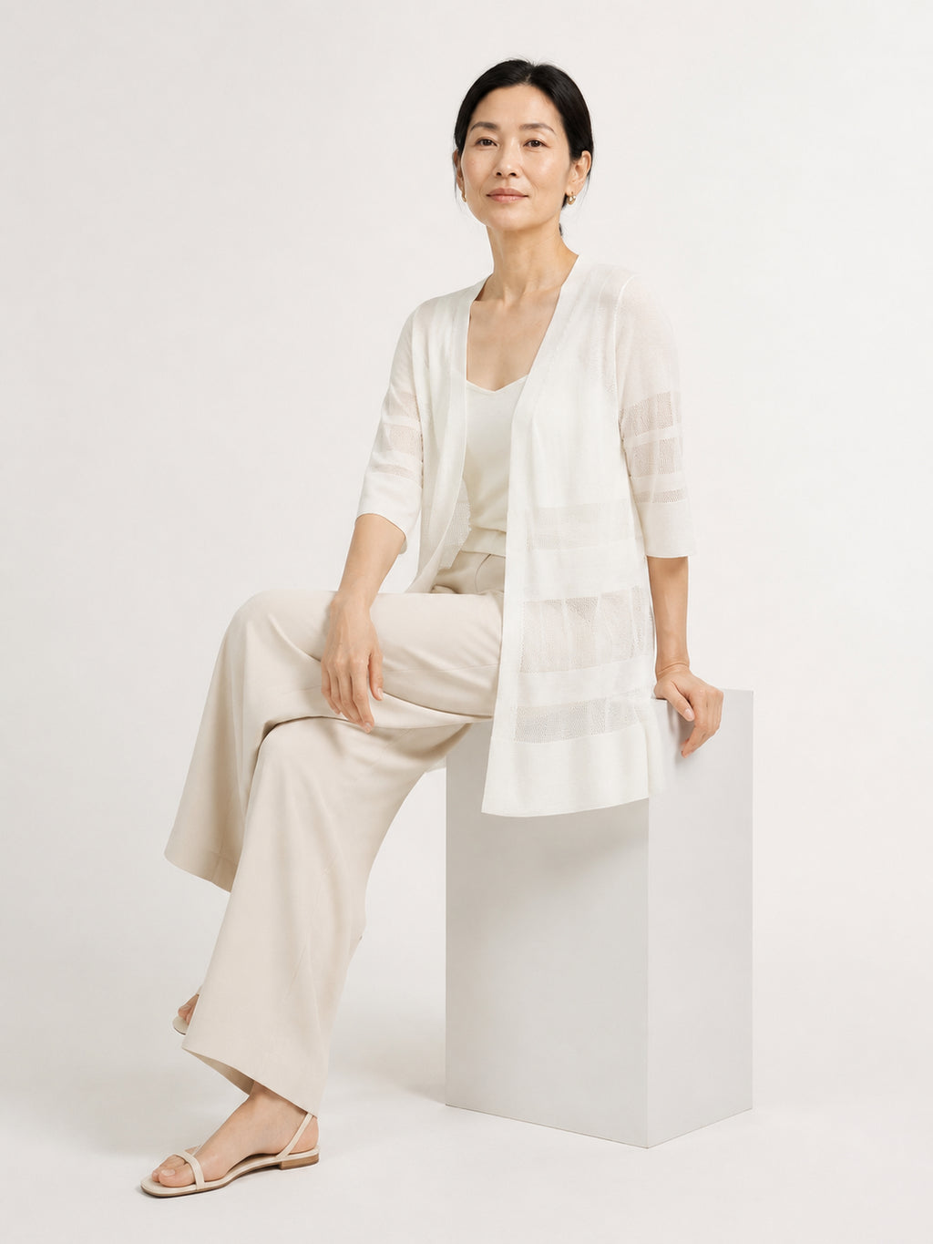 MY022 white long openwork v-neck cardigan seated model view