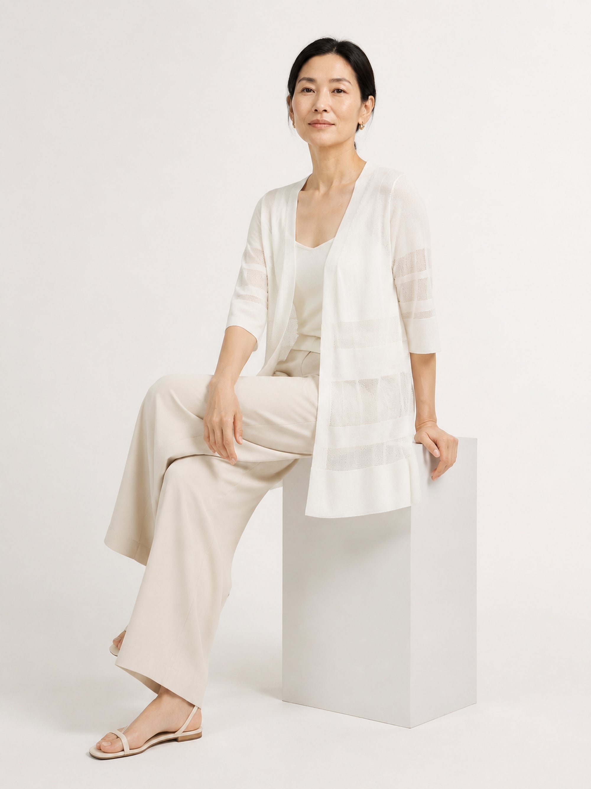 MY022 white long openwork v-neck cardigan seated model view