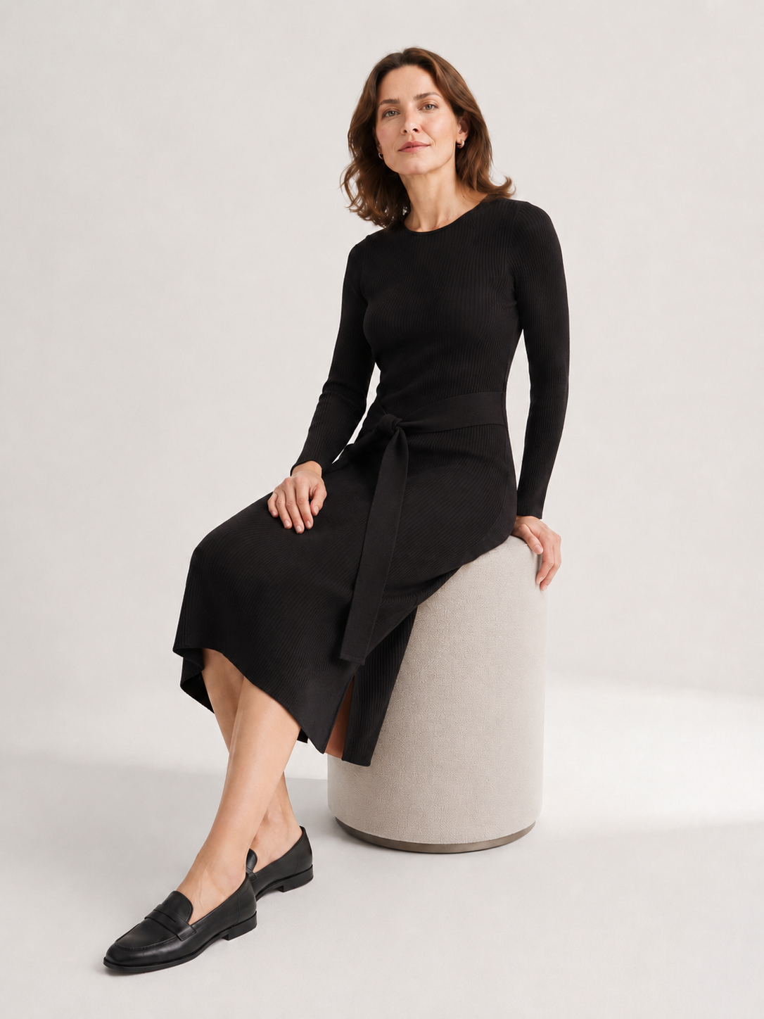 MY012 black ribbed side-slit sweater dress seated model view