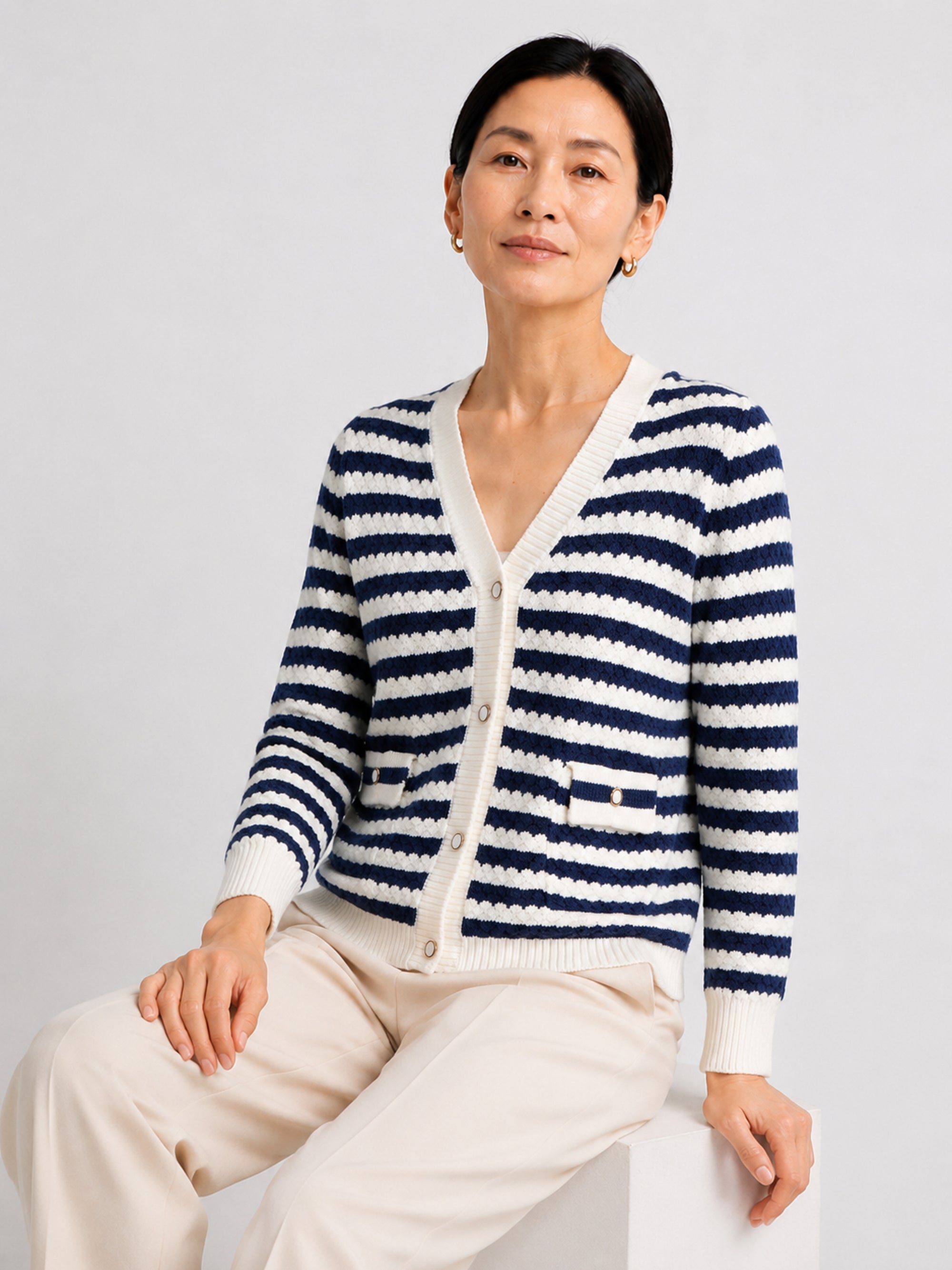 MY009 blue cropped textured knit cardigan seated model view