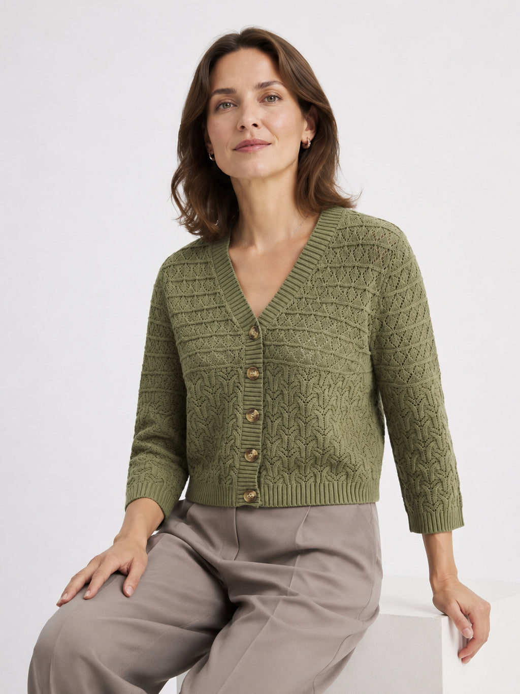 MY015 green openwork three-quarter sleeve cardigan seated model view