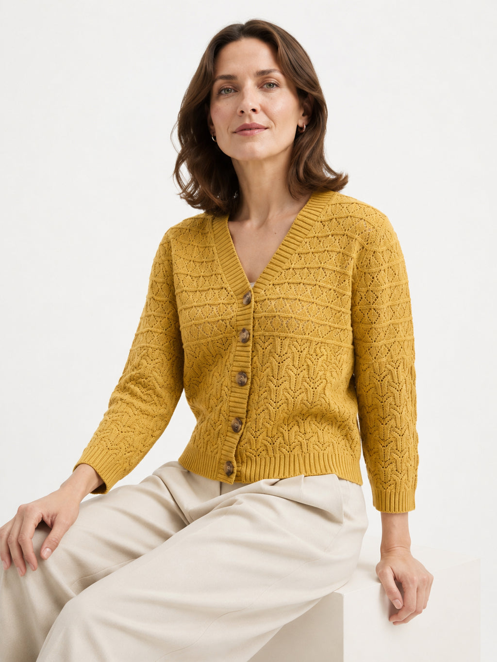 MY015 yellow openwork three-quarter sleeve cardigan seated model view