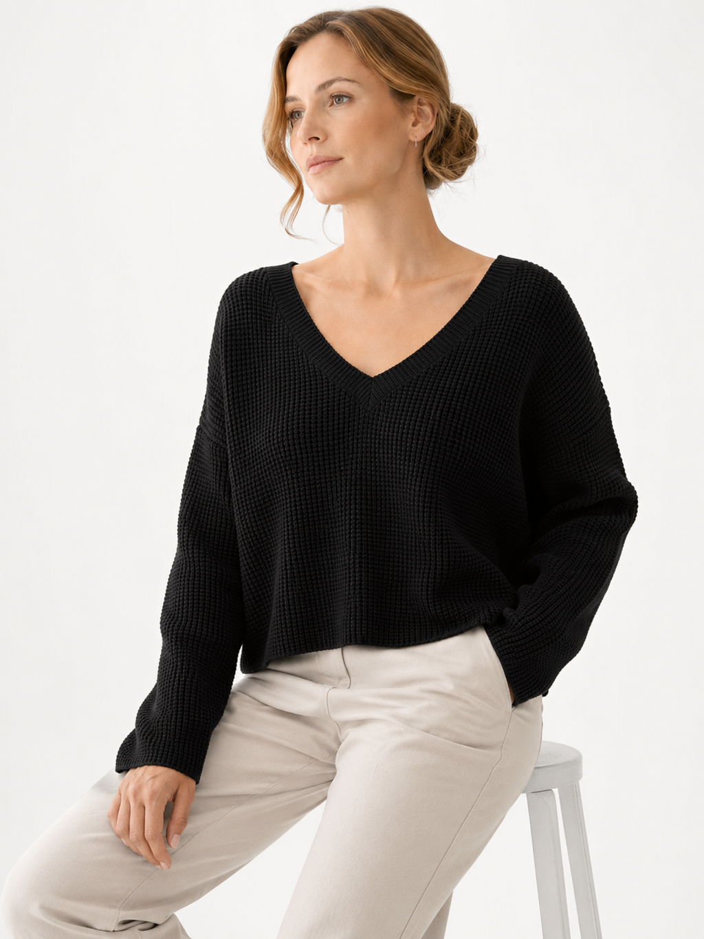 MY016 black cropped v-neck knit sweater seated model view