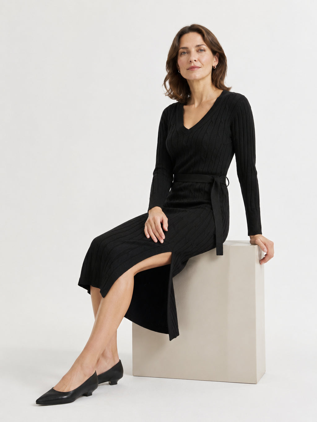 MY011 black v-neck belted knit dress seated model view
