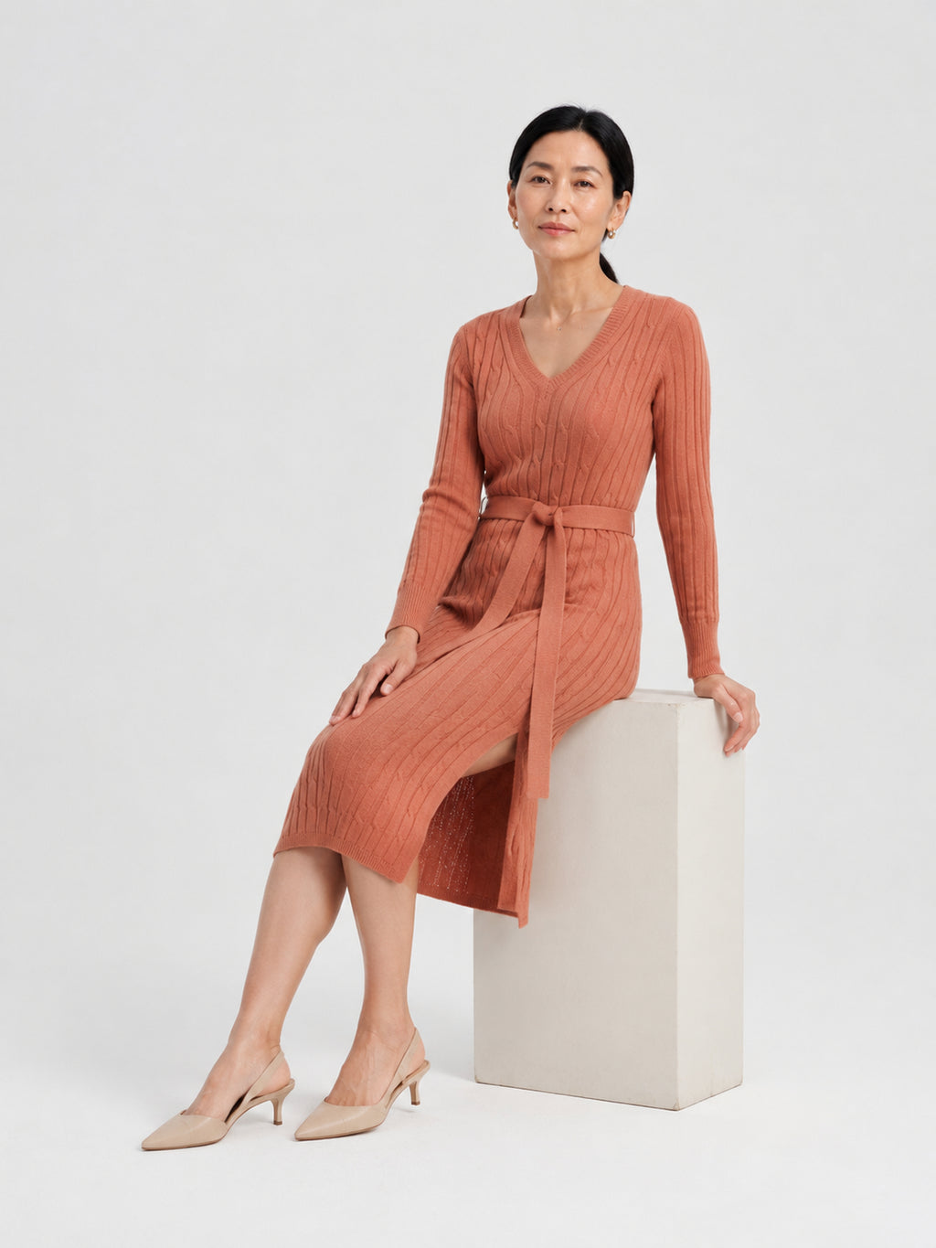 MY011 orange red v-neck belted knit dress seated model view